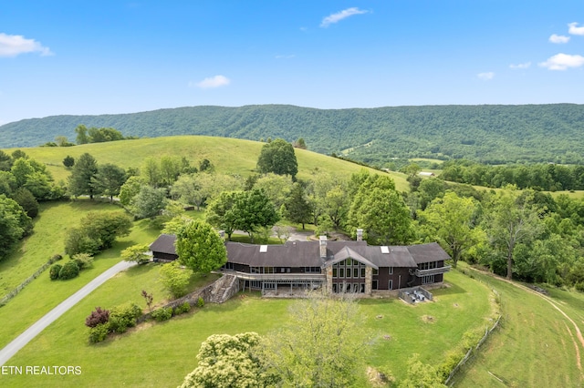 drone / aerial view with a mountain view and a rural view