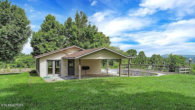 exterior space with a lawn and a patio area