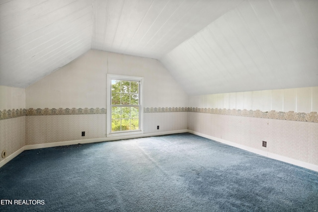 bonus room featuring carpet flooring and lofted ceiling