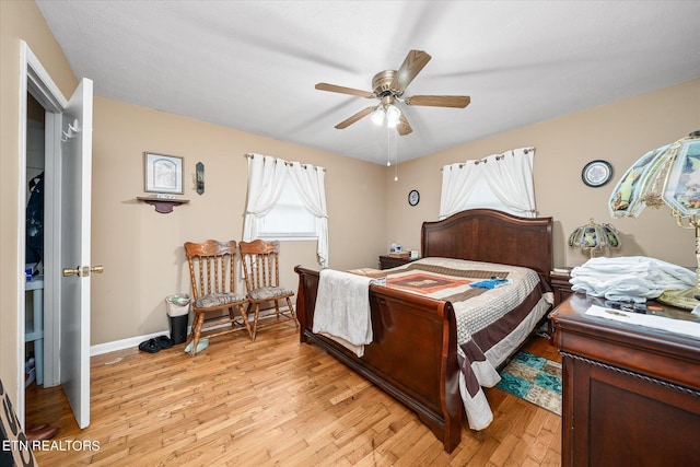 bedroom featuring ceiling fan and light hardwood / wood-style flooring