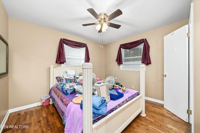 bedroom featuring ceiling fan and hardwood / wood-style flooring