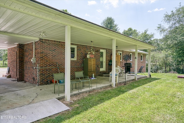 rear view of house with a patio area and a yard