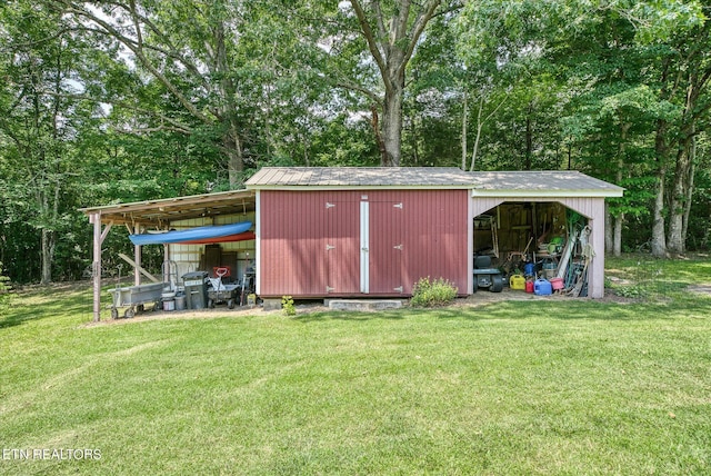 view of outdoor structure featuring a lawn