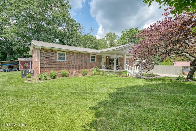 view of front facade with a front lawn and a porch