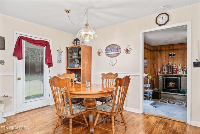 dining room with wood-type flooring and a notable chandelier