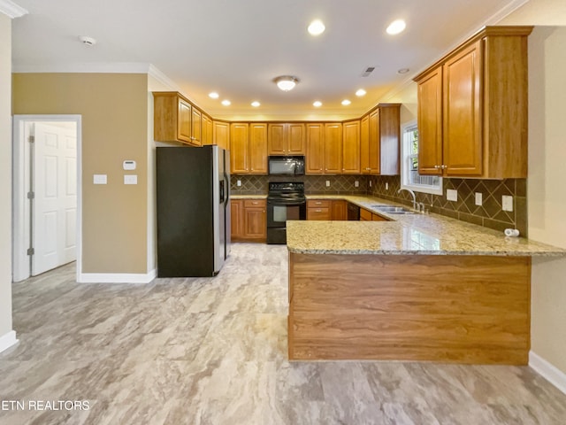 kitchen featuring black appliances, sink, kitchen peninsula, light stone counters, and crown molding