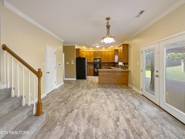 kitchen featuring french doors, ornamental molding, and black appliances