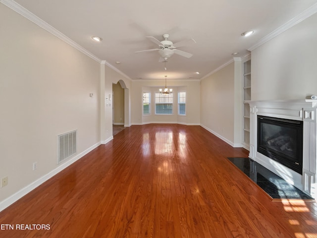 unfurnished living room with ornamental molding, wood-type flooring, and ceiling fan with notable chandelier