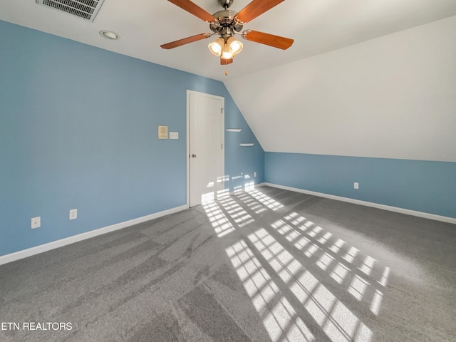 bonus room with lofted ceiling, carpet flooring, and ceiling fan