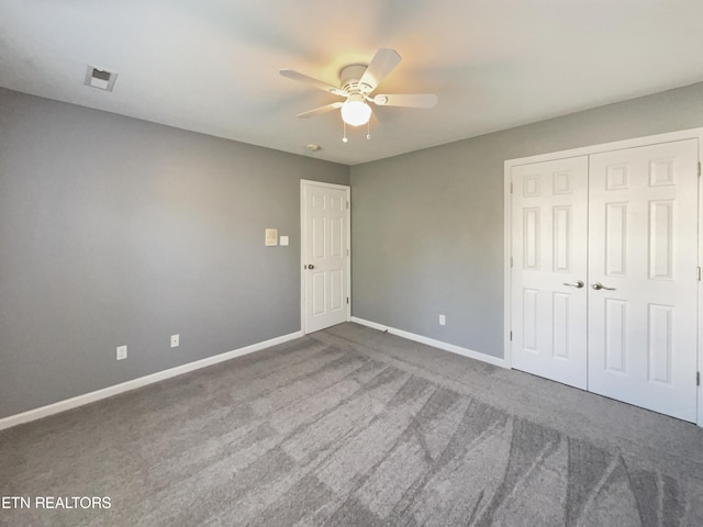 unfurnished bedroom featuring a closet, ceiling fan, and carpet