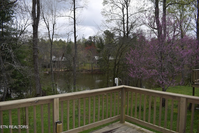 wooden terrace with a water view
