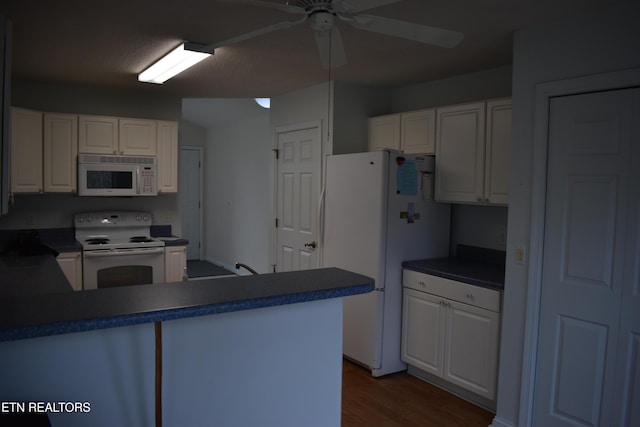 kitchen with ceiling fan, white appliances, a peninsula, dark wood finished floors, and white cabinetry