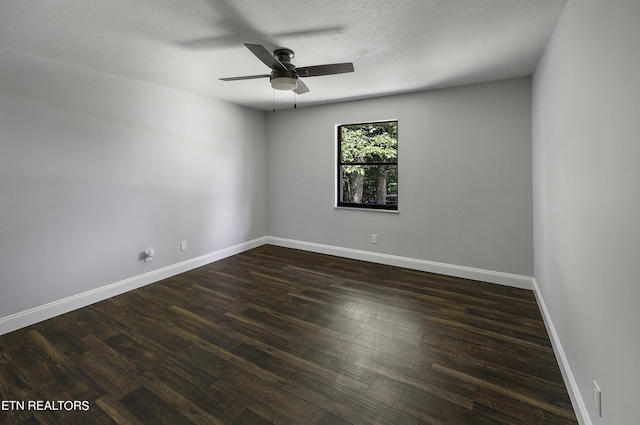 spare room with ceiling fan, dark hardwood / wood-style flooring, and a textured ceiling