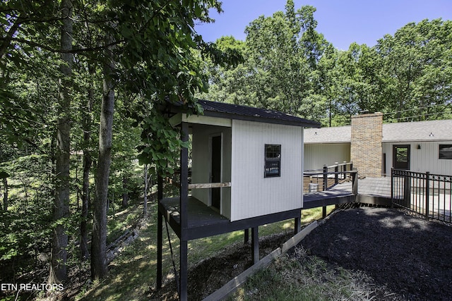 exterior space featuring a wooden deck