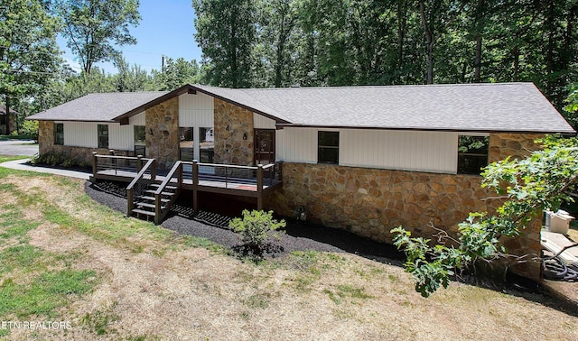 ranch-style home with a deck