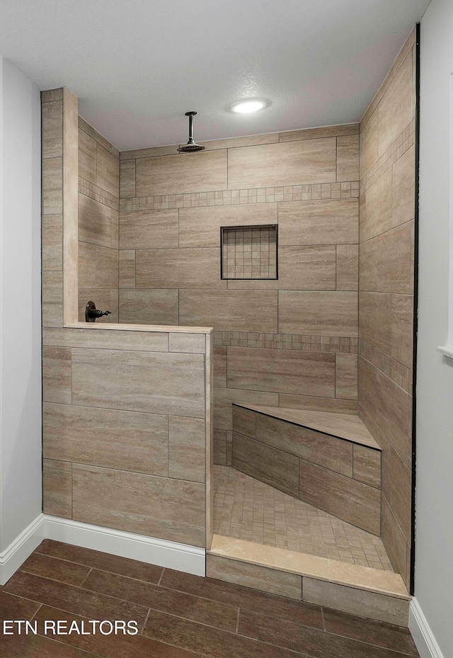 bathroom featuring a tile shower