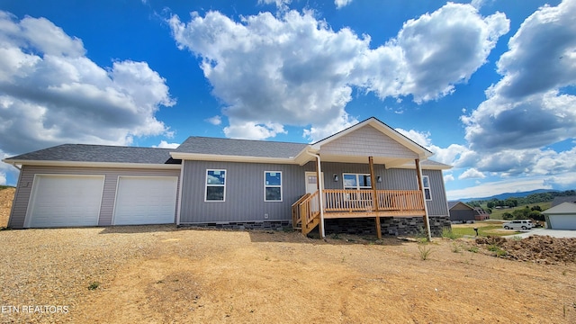 view of front of property with a porch and a garage