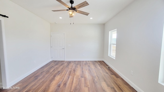 unfurnished room with recessed lighting, visible vents, a ceiling fan, baseboards, and light wood finished floors