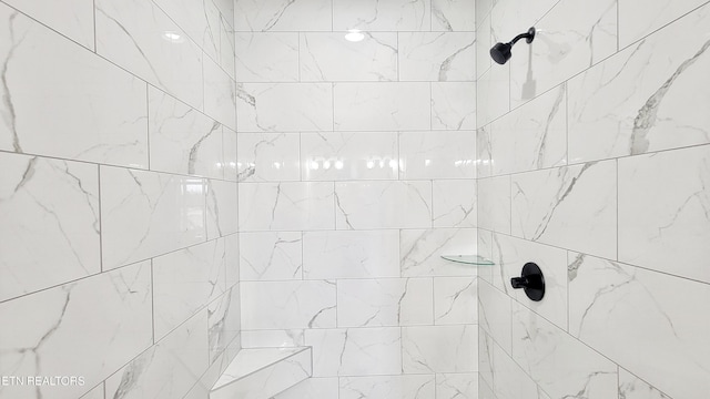 interior space featuring tiled shower