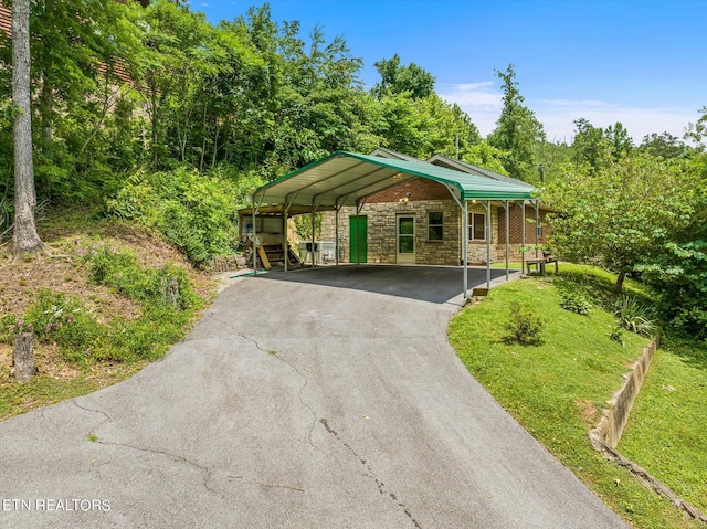 single story home with a carport