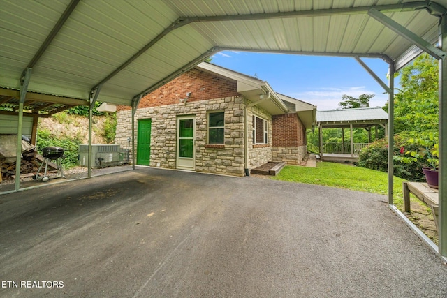 view of patio / terrace with a grill and a carport