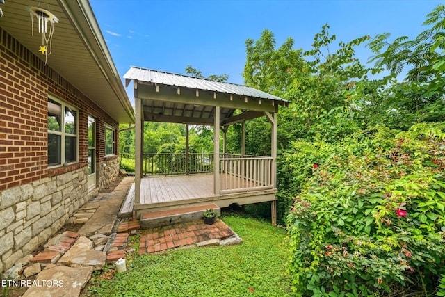 view of yard with a wooden deck