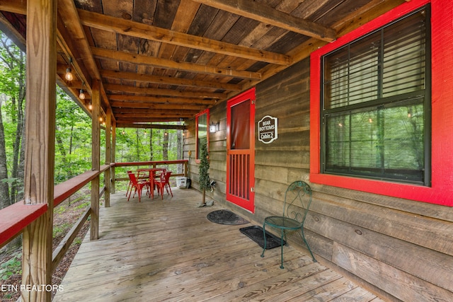 wooden terrace with a porch