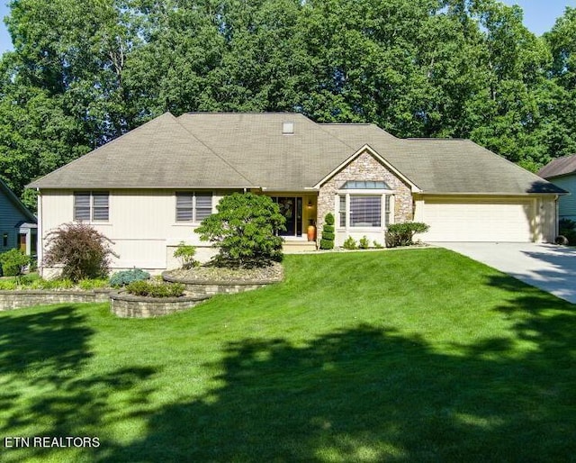 ranch-style house with a front lawn and a garage