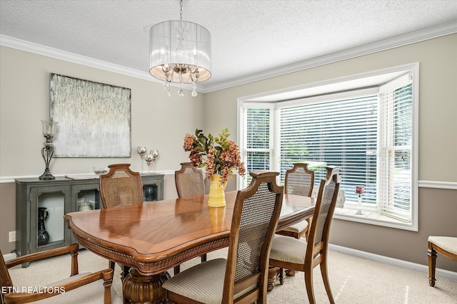 dining room featuring a notable chandelier, plenty of natural light, and crown molding