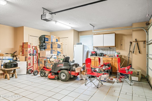 garage with electric panel and a garage door opener