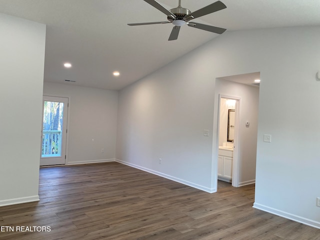 unfurnished room featuring ceiling fan, dark wood-type flooring, and vaulted ceiling