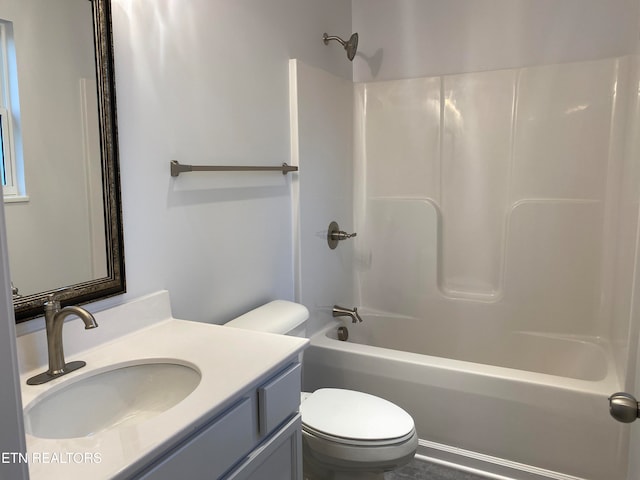 full bathroom with shower / tub combination, vanity, and toilet