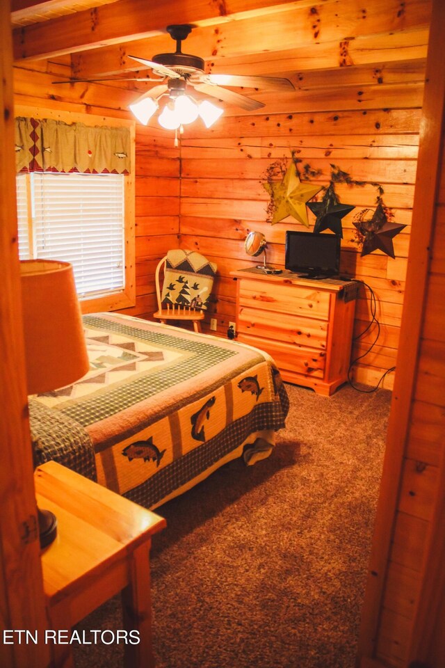 carpeted bedroom featuring rustic walls