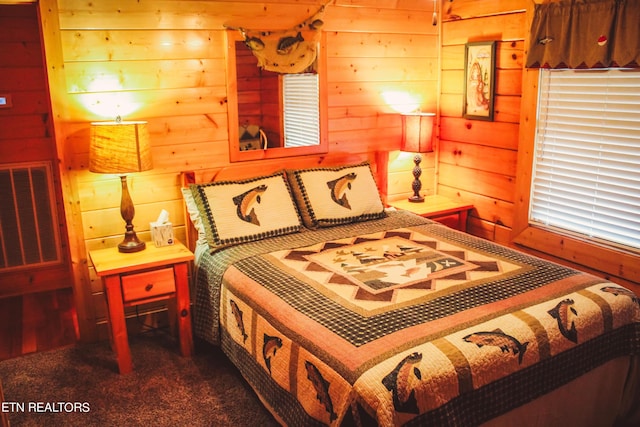 bedroom featuring dark colored carpet