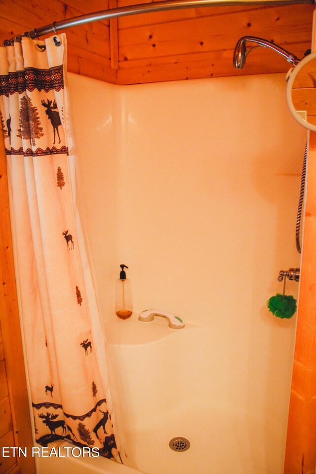 bathroom with a shower with curtain