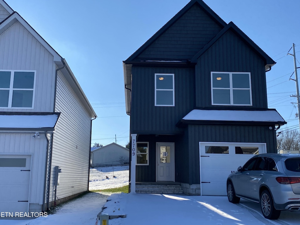 view of front of property with a garage