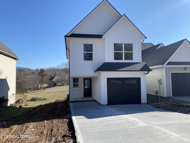 modern farmhouse style home with a garage