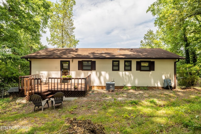 view of front of property with central AC unit and a deck