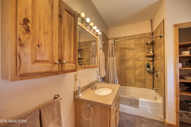 bathroom with shower / bath combo with shower curtain and vanity