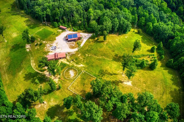 birds eye view of property with a rural view