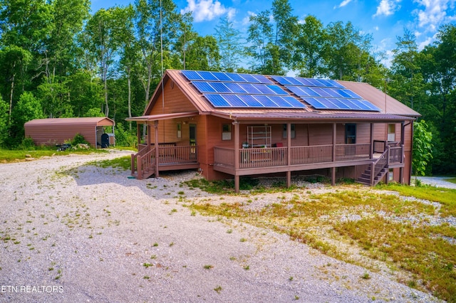 view of front of property featuring solar panels