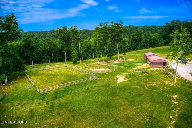 birds eye view of property with a rural view