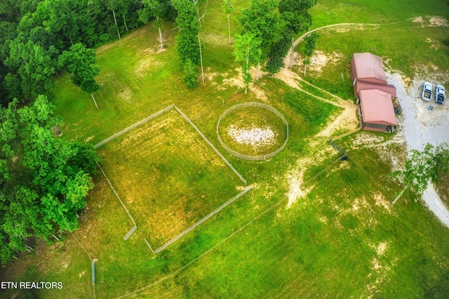 birds eye view of property with a rural view