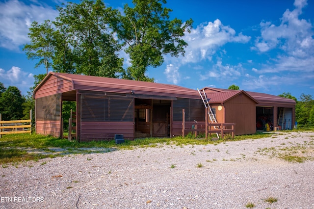 view of front of house featuring an outbuilding