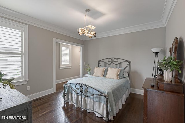 bedroom with dark hardwood / wood-style flooring, a notable chandelier, ornamental molding, and multiple windows