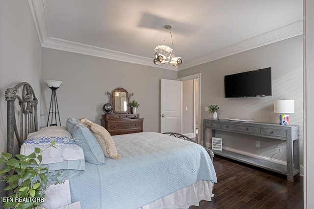 bedroom with dark hardwood / wood-style flooring, an inviting chandelier, and ornamental molding