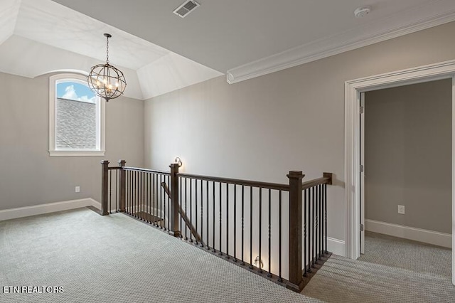 hallway with light carpet, crown molding, a chandelier, and lofted ceiling