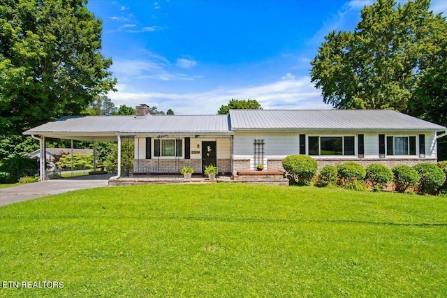 ranch-style home with a front lawn and a carport