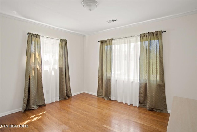 empty room with hardwood / wood-style flooring