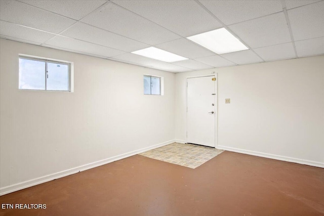 basement featuring a drop ceiling